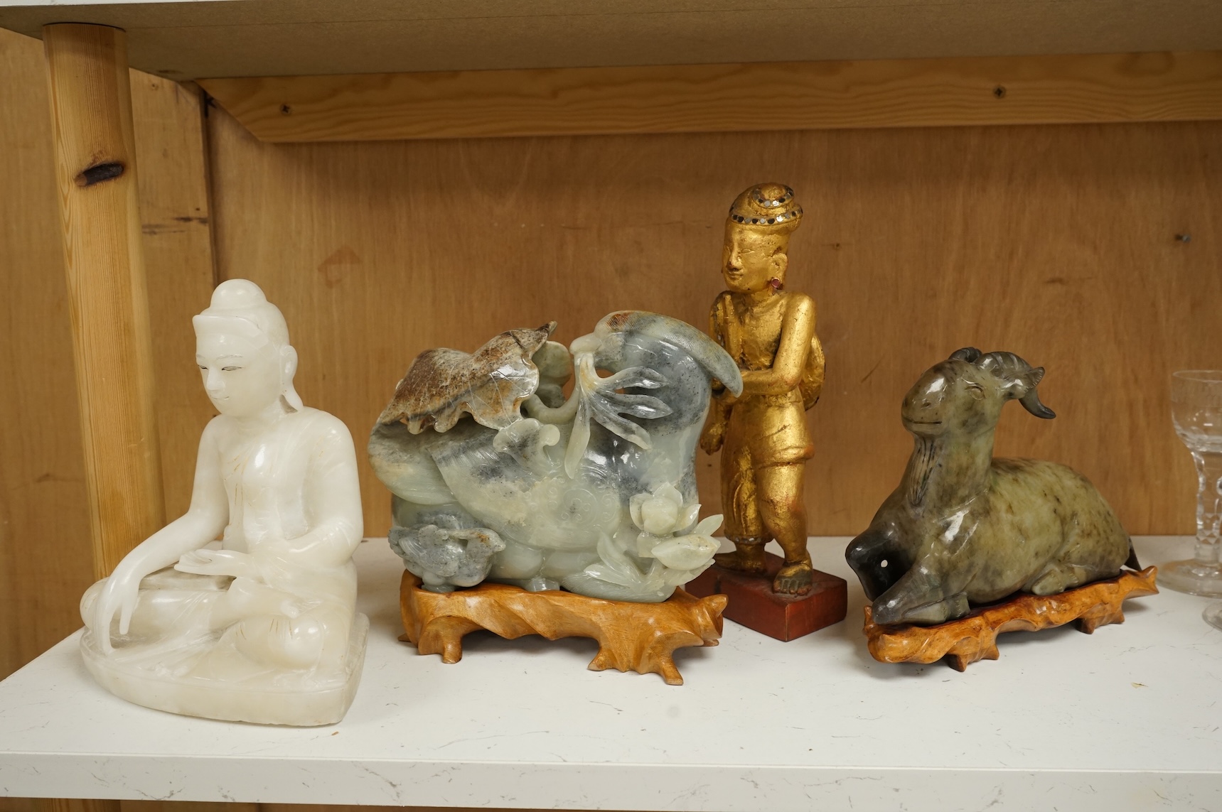 Two modern jade figures, together with a marble Buddha and a carved giltwood figure, largest 24cm wide